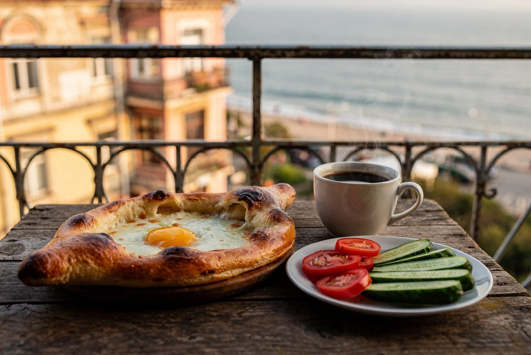 Adjarian khachapuri and breakfast table with morning light in Georgia