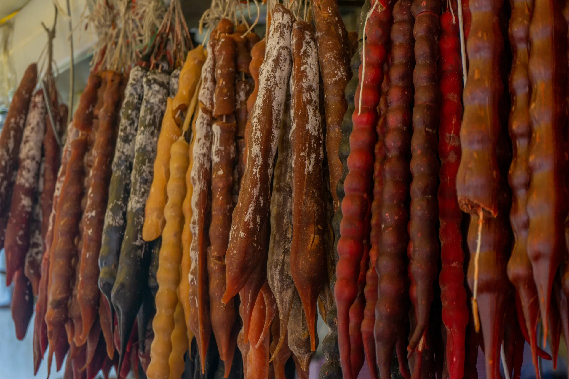 Traditional Georgian churchkhela hanging at a market stall