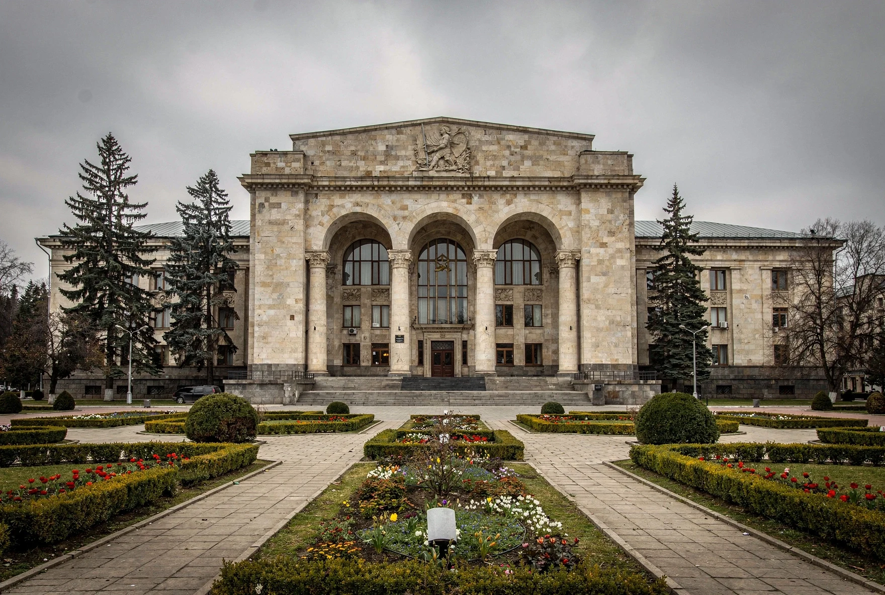 Grand neoclassical facade of the Stalin Museum in Gori with columns and formal gardens