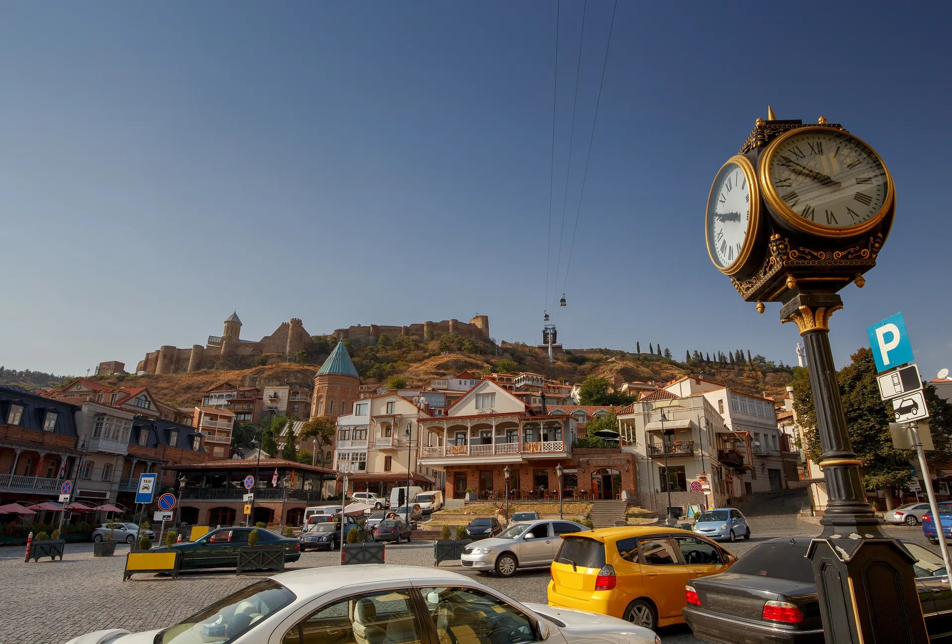 View of Tbilisi Old Town with Narikala Fortress on the hill above traditional houses and the Kura River