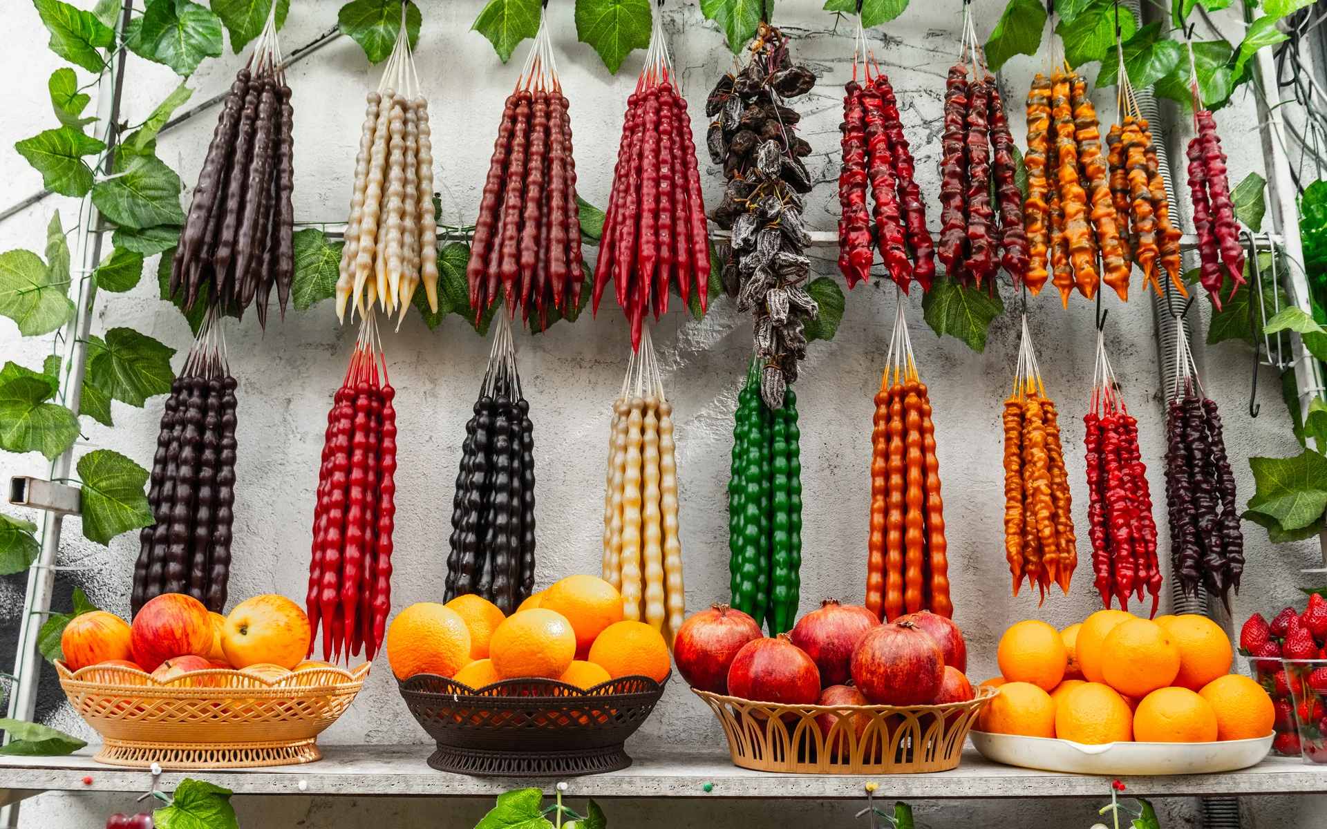 Churchkhela — traditional Georgian candy made from grape juice and walnuts — hanging at a market stall