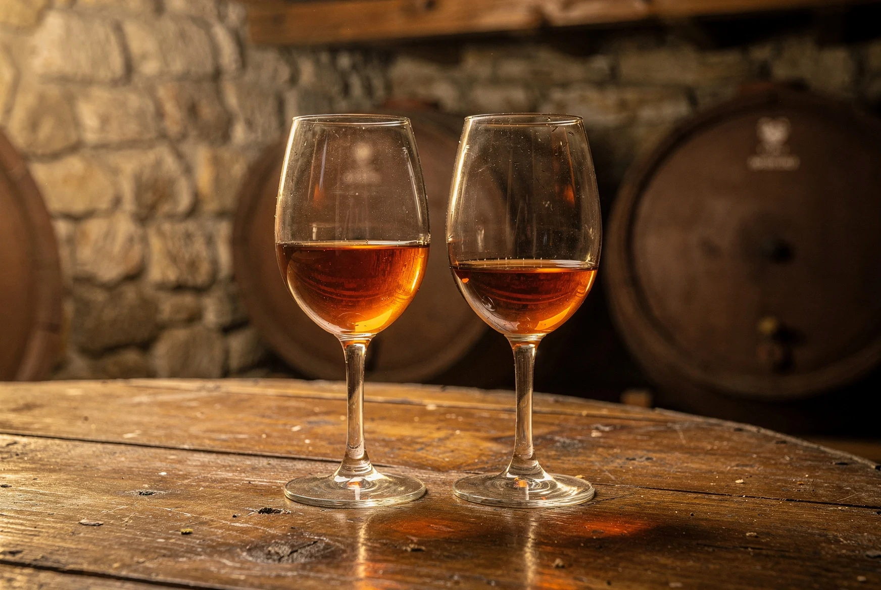 Glasses of Georgian amber wine in a cellar setting