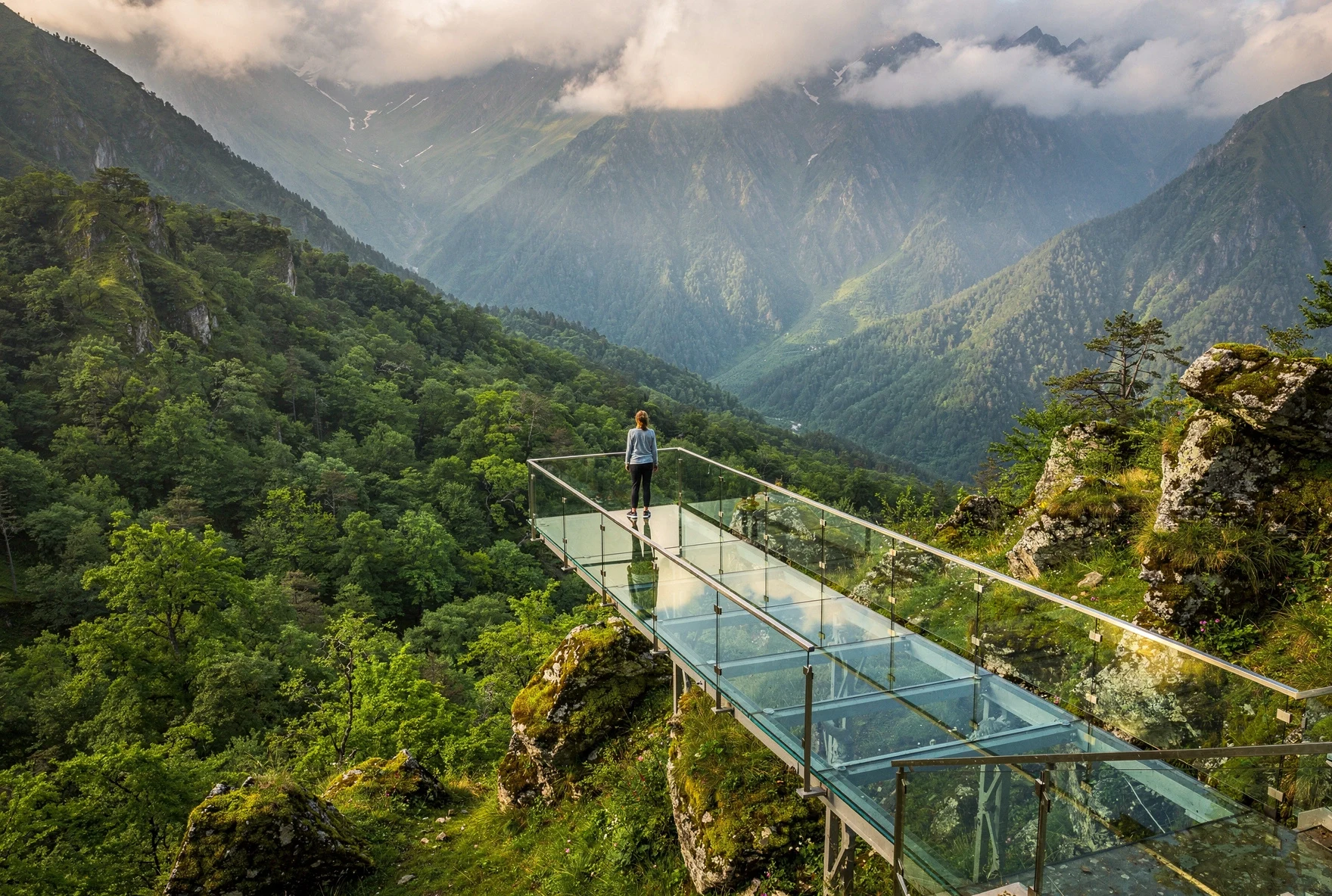 Glass observation platform at Sataplia Nature Reserve overlooking the forested Imereti valley