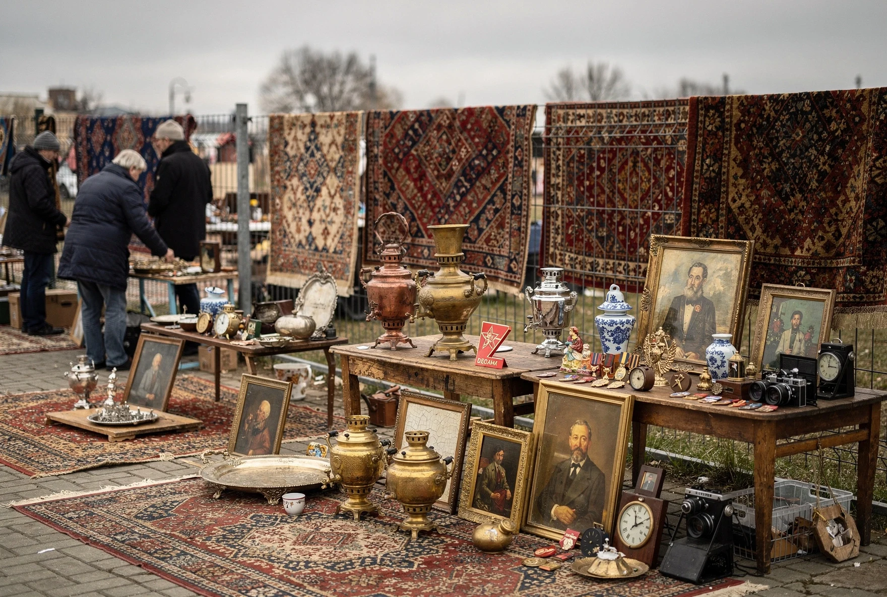 Tbilisi's Dry Bridge flea market with antique samovars, paintings, and carpets on display